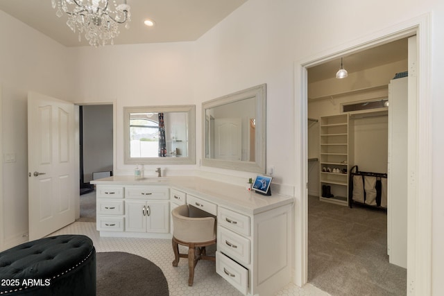 8502 E Santa Catalina Dr, Scottsdale, AZ 85255 - bathroom with a chandelier, vanity, and recessed lighting