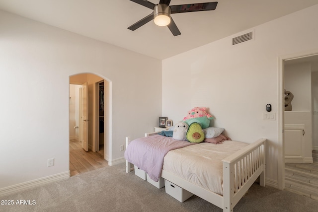 8502 E Santa Catalina Dr, Scottsdale, AZ 85255 - carpeted bedroom featuring arched walkways, baseboards, and a ceiling fan