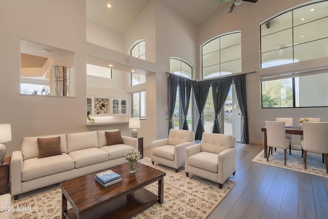 8502 E Santa Catalina Dr, Scottsdale, AZ 85255 - living area with a high ceiling, wood finished floors, and baseboards