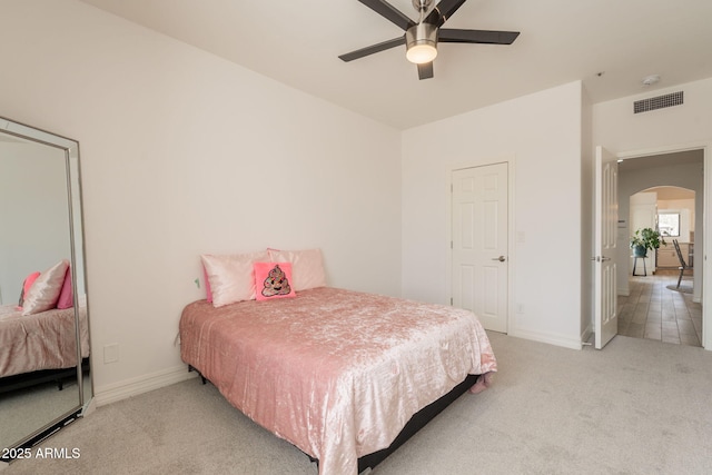 8502 E Santa Catalina Dr, Scottsdale, AZ 85255 - carpeted bedroom featuring arched walkways, baseboards, and a ceiling fan