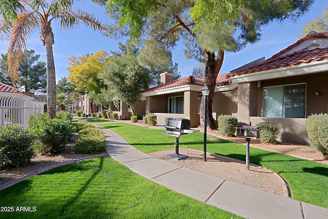 view of home's community featuring a lawn