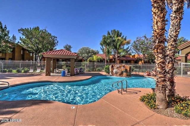 view of swimming pool featuring a gazebo, a patio area, and pool water feature