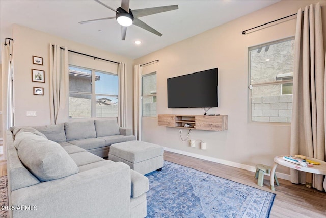 1895 N 141st Ave, Goodyear, AZ 85395 - living room featuring ceiling fan, wood finished floors, baseboards, and recessed lighting