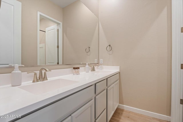 1895 N 141st Ave, Goodyear, AZ 85395 - full bath featuring baseboards, wood finished floors, and double vanity