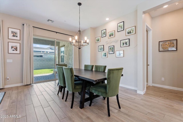 1895 N 141st Ave, Goodyear, AZ 85395 - dining space featuring light wood-type flooring, baseboards, a chandelier, and recessed lighting