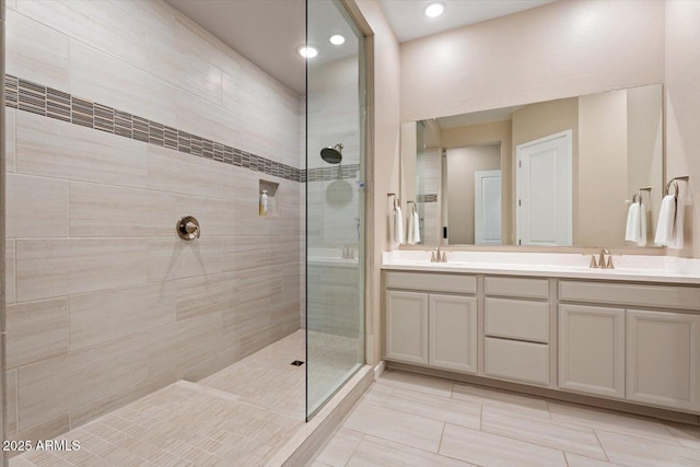 1895 N 141st Ave, Goodyear, AZ 85395 - bathroom featuring tiled shower, double vanity, and recessed lighting