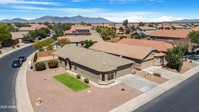 bird's eye view with a residential view and a mountain view