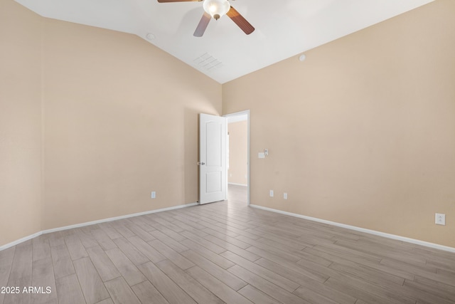 spare room featuring ceiling fan, high vaulted ceiling, baseboards, light wood-type flooring, and visible vents