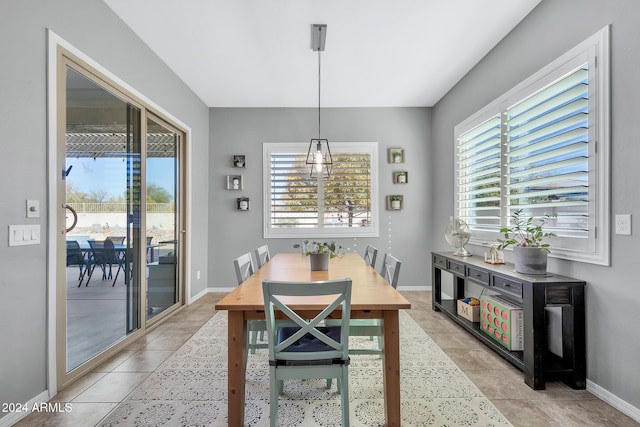 dining space with light tile patterned flooring