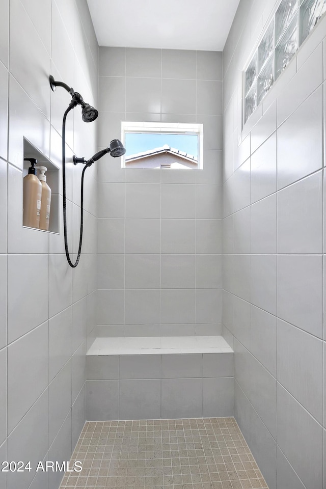 bathroom featuring tiled shower