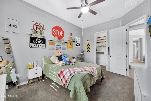 bedroom featuring carpet flooring, ceiling fan, and a spacious closet