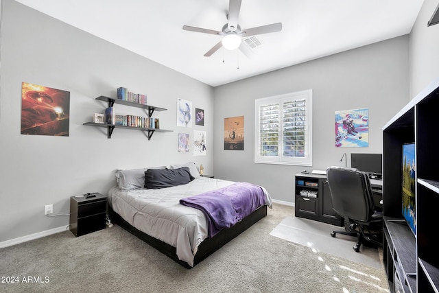 bedroom featuring light colored carpet and ceiling fan