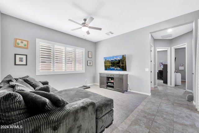 living room with ceiling fan and light colored carpet