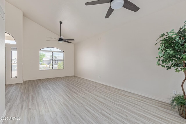 4933 E Downing St, Mesa, AZ 85205 - unfurnished living room featuring a ceiling fan, light wood-style floors, and high vaulted ceiling