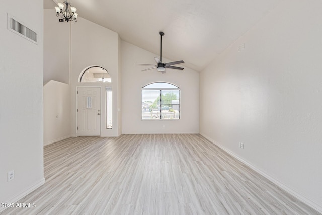 4933 E Downing St, Mesa, AZ 85205 - unfurnished living room with light wood-style flooring, a ceiling fan, a chandelier, and high vaulted ceiling