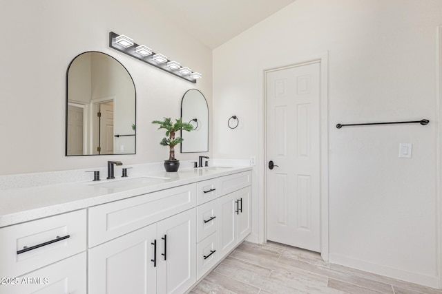 4933 E Downing St, Mesa, AZ 85205 - full bathroom featuring double vanity, wood finished floors, and lofted ceiling