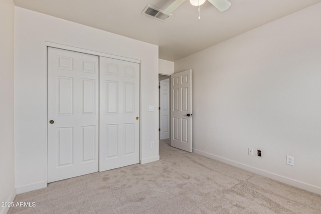 4933 E Downing St, Mesa, AZ 85205 - unfurnished bedroom featuring carpet, a closet, and a ceiling fan