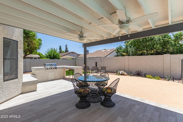 4933 E Downing St, Mesa, AZ 85205 - wooden terrace featuring ceiling fan, area for grilling, a fenced backyard, a patio area, and outdoor dining area