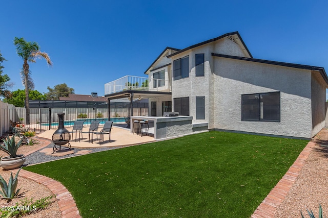 4933 E Downing St, Mesa, AZ 85205 - rear view of house featuring a balcony, a fenced backyard, a patio area, and stucco siding