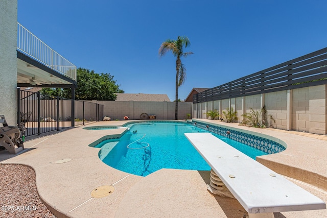 4933 E Downing St, Mesa, AZ 85205 - view of pool with a fenced backyard, a patio area, a pool with connected hot tub, and a diving board