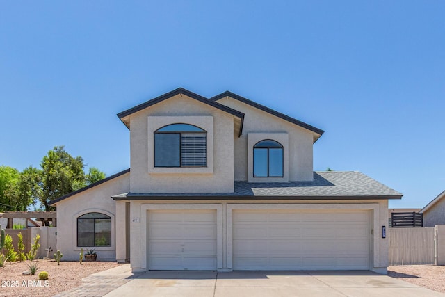 4933 E Downing St, Mesa, AZ 85205 - view of front of property with a garage, stucco siding, concrete driveway, and roof with shingles