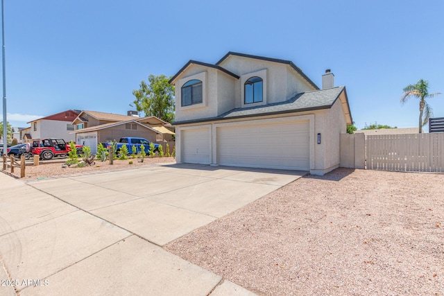4933 E Downing St, Mesa, AZ 85205 - view of front of house featuring an attached garage, concrete driveway, stucco siding, a chimney, and a gate