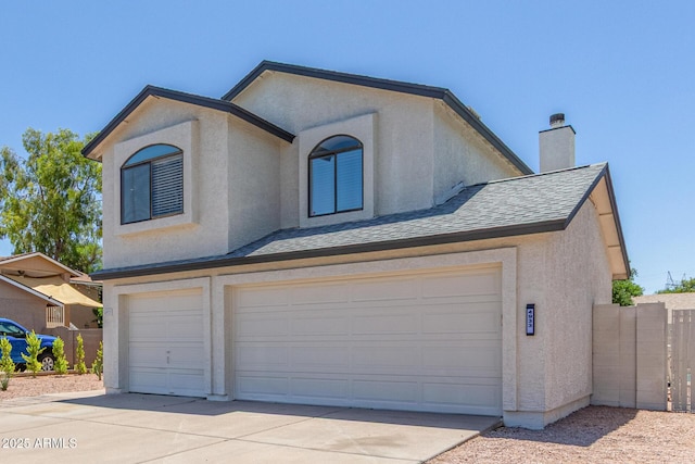 4933 E Downing St, Mesa, AZ 85205 - view of front of property featuring an attached garage, stucco siding, roof with shingles, and a chimney