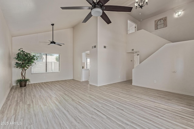 4933 E Downing St, Mesa, AZ 85205 - unfurnished living room with ceiling fan, wood finished floors, and high vaulted ceiling