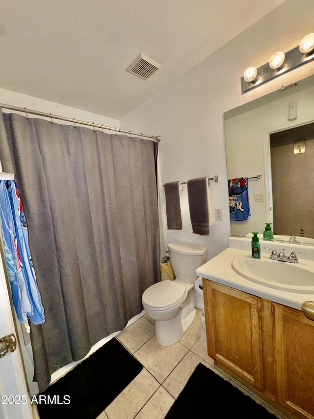 bathroom featuring tile patterned floors, visible vents, toilet, a shower with curtain, and vanity