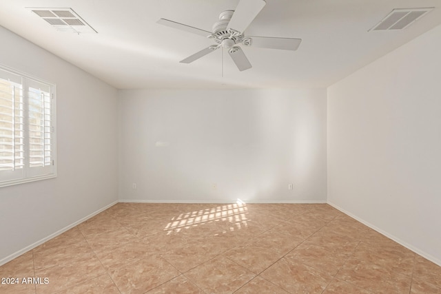 unfurnished room with ceiling fan