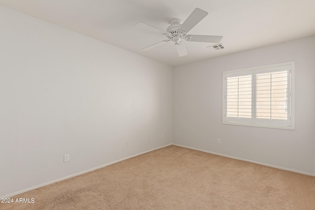 empty room with light carpet and ceiling fan