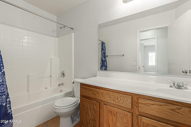 full bathroom featuring tile patterned floors, shower / bath combination with curtain, toilet, and vanity