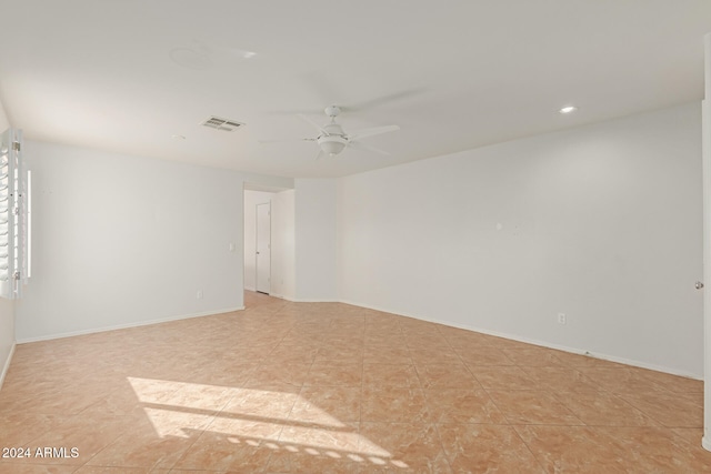 spare room with ceiling fan