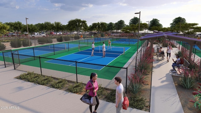 view of tennis court featuring fence