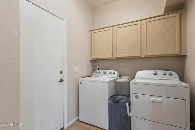 7736 W Tumblewood Dr, Peoria, AZ 85382 - laundry area with independent washer and dryer, cabinet space, and light tile patterned flooring