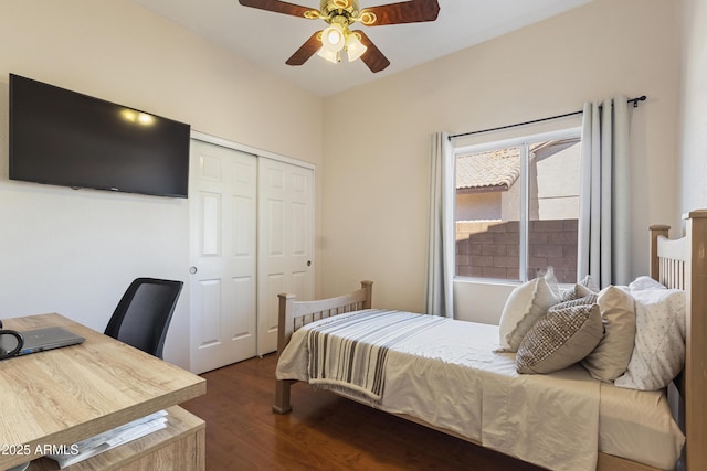 7736 W Tumblewood Dr, Peoria, AZ 85382 - bedroom with a closet, dark wood-style floors, a desk, and a ceiling fan