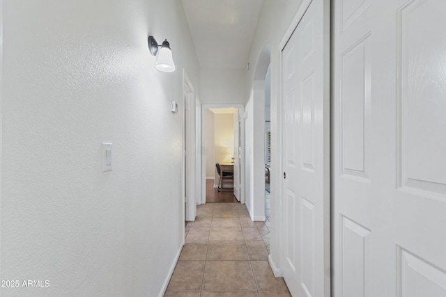 7736 W Tumblewood Dr, Peoria, AZ 85382 - hall with light tile patterned floors and baseboards