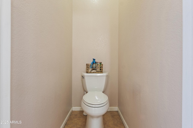 7736 W Tumblewood Dr, Peoria, AZ 85382 - bathroom featuring baseboards and toilet