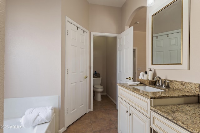 7736 W Tumblewood Dr, Peoria, AZ 85382 - bathroom with vanity and tile patterned floors