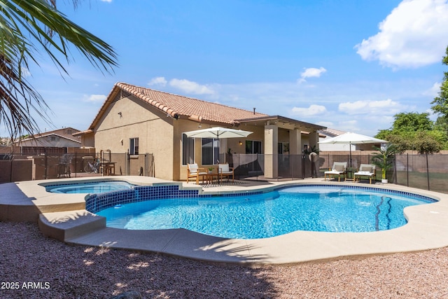 7736 W Tumblewood Dr, Peoria, AZ 85382 - view of swimming pool featuring a patio and a pool with connected hot tub