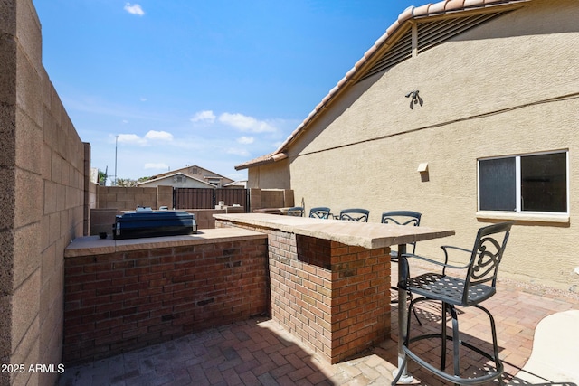 7736 W Tumblewood Dr, Peoria, AZ 85382 - fenced backyard with a patio area and an outdoor kitchen
