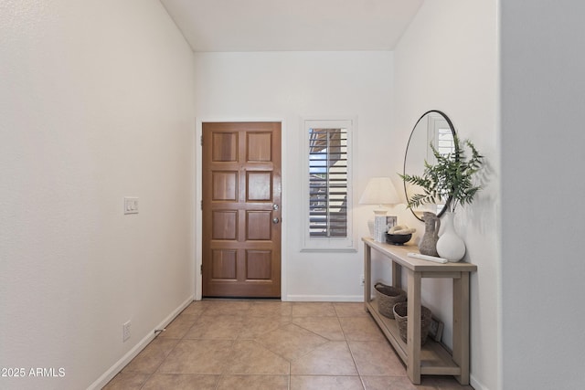 7736 W Tumblewood Dr, Peoria, AZ 85382 - foyer entrance with baseboards and light tile patterned floors