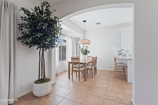 7736 W Tumblewood Dr, Peoria, AZ 85382 - dining room featuring arched walkways and light tile patterned floors