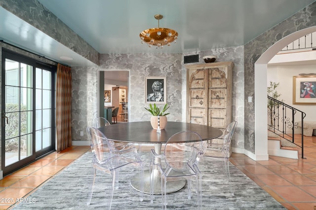 dining area featuring tile patterned flooring