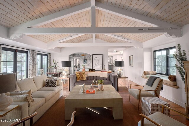 living room with wooden ceiling, lofted ceiling with beams, and plenty of natural light