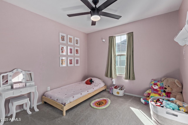 carpeted bedroom featuring ceiling fan and baseboards