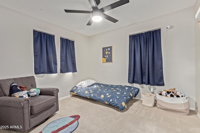 bedroom featuring a ceiling fan, baseboards, and carpet flooring