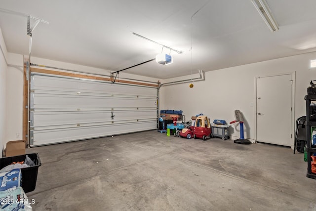 garage featuring a garage door opener