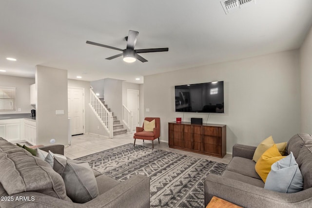 living area featuring recessed lighting, visible vents, stairway, and light tile patterned flooring