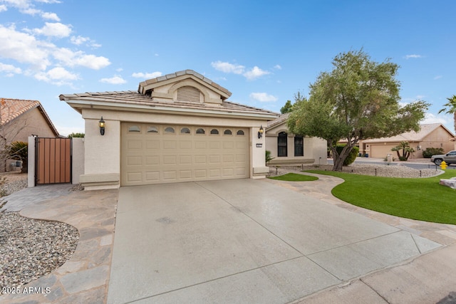 view of front of property featuring a front yard and a garage